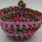 This shows the "backside" of the basket with the back of the knot. The base of the bowl is about 5" and the width is about 7.5" by 4" deep.